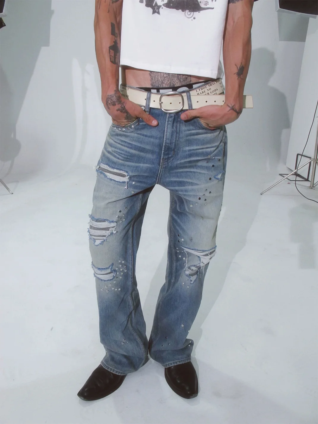 VOWPROGRESS | Houndstooth Patch Distressed Studded Flared Jeans