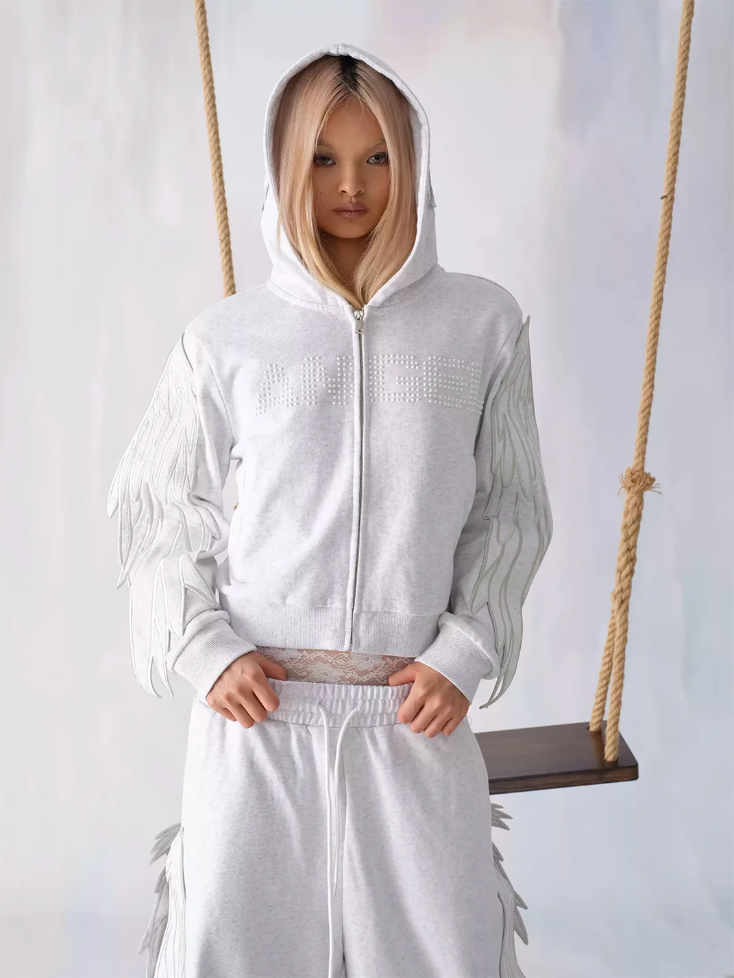 CHAI | Cropped Wing Applique Pearl Zip-Up Hoodie