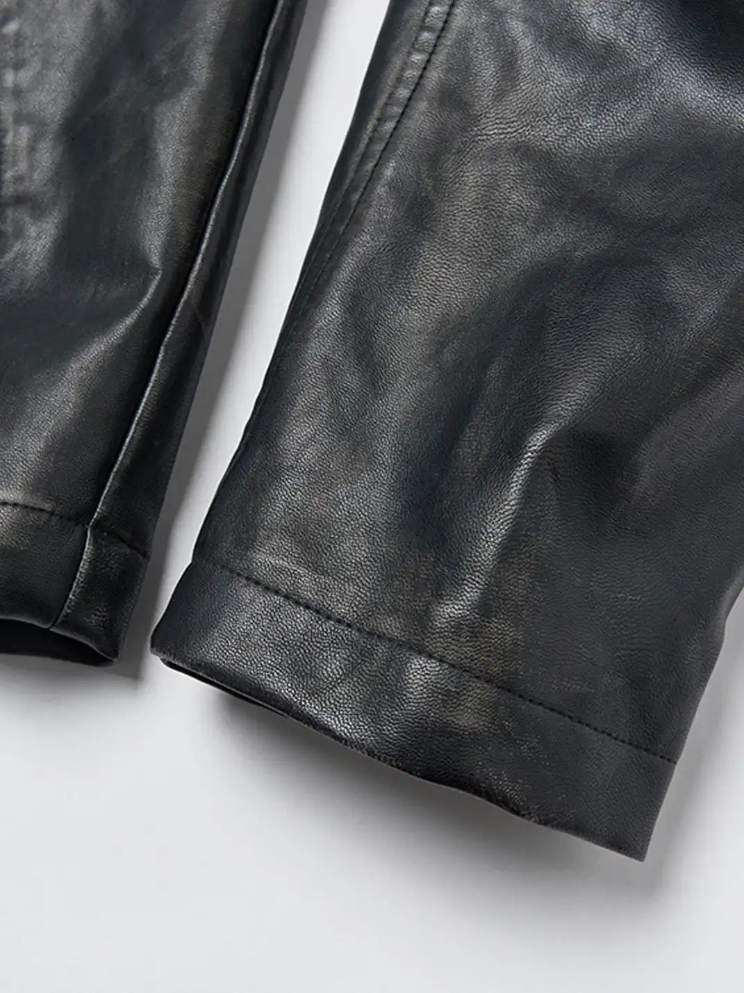 SGW | Crossed Spliced Rivet Faux Leather Jacket