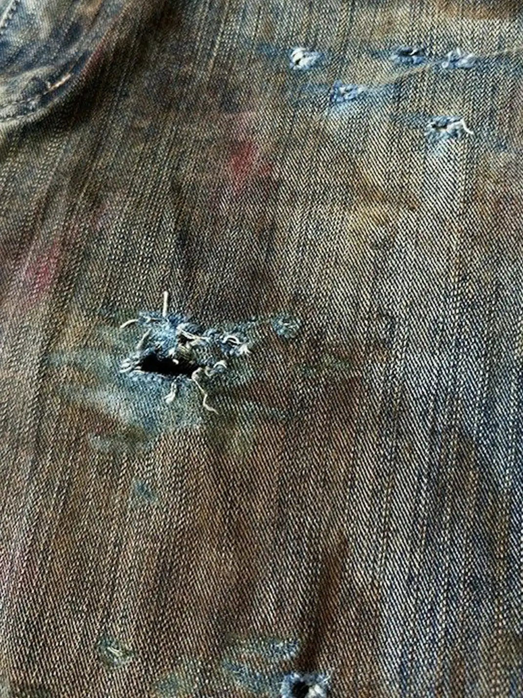 Laukerward | Bloodstained And Tattered Jeans By War Criminals