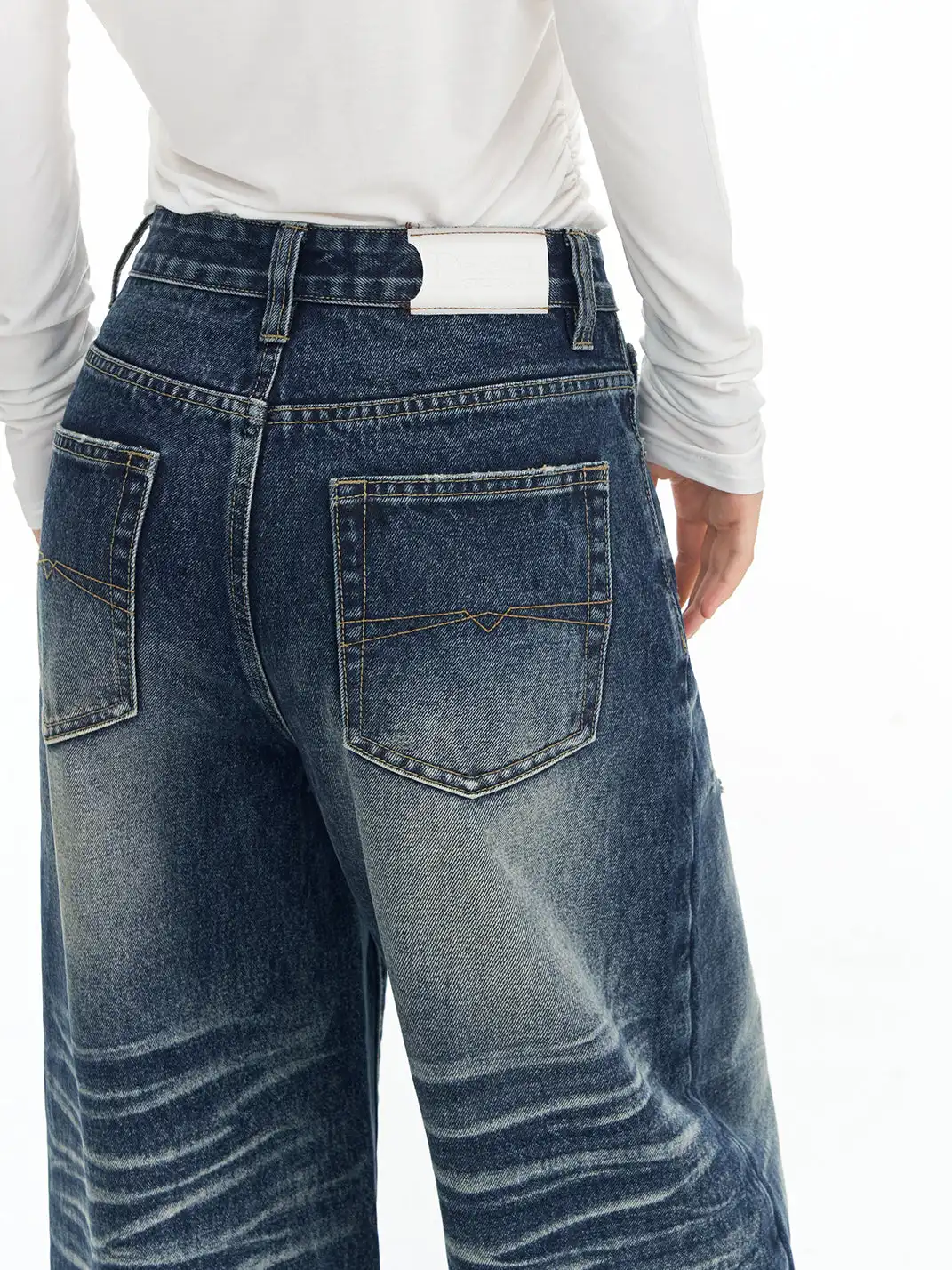 DeleteEX | Curved Washed Saucer Jeans