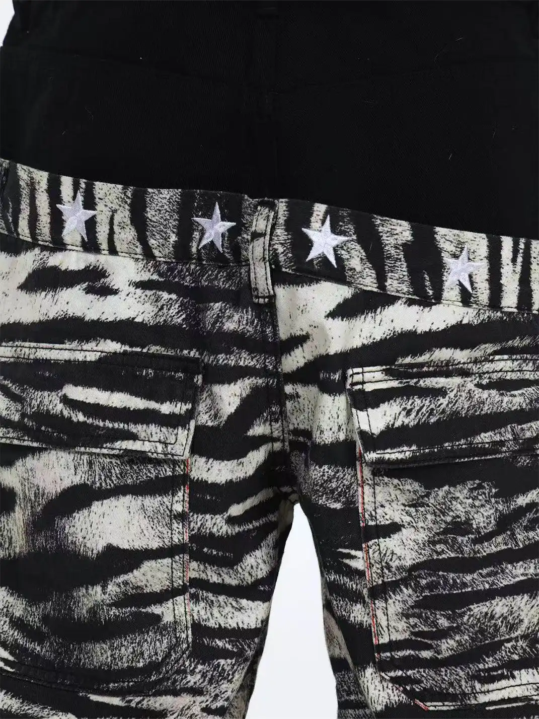 DETW | Zebra-Print Slanted Waist Jeans