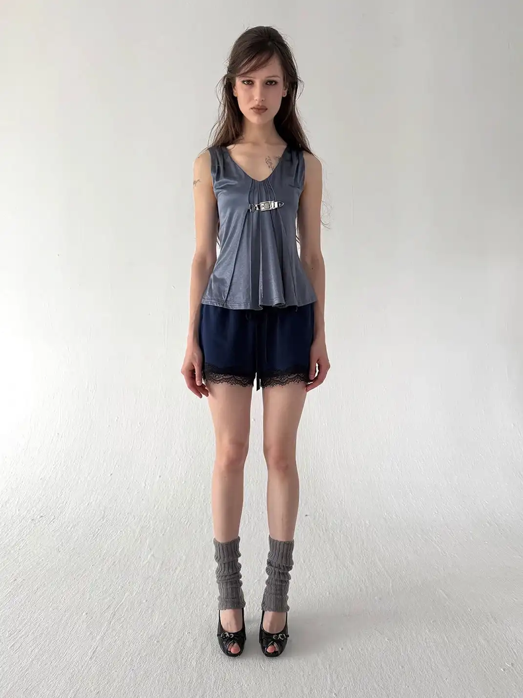 High river | Metal Buckle Ruched Satin-Textured Knit V-Neck Vest