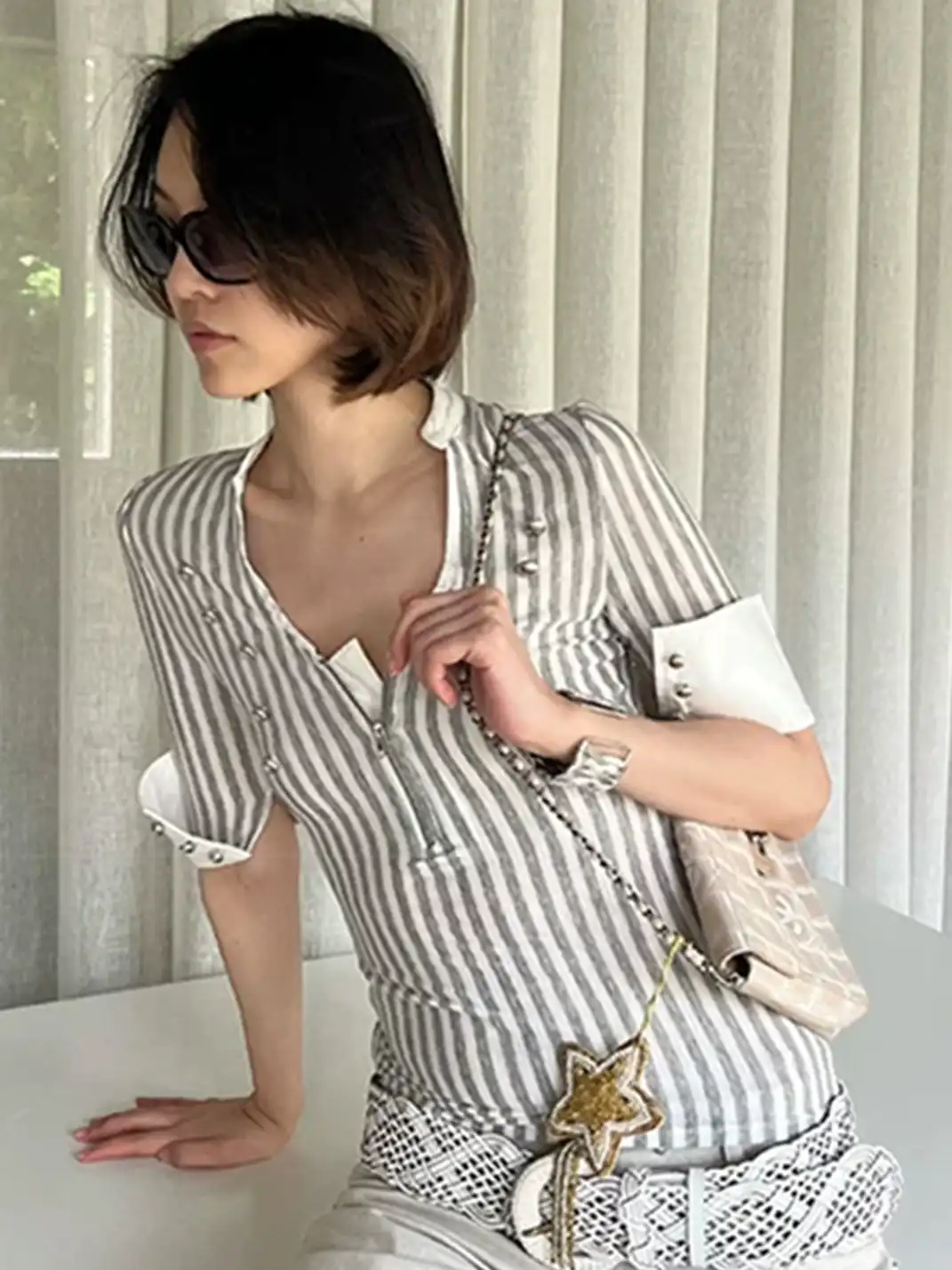 High river | Striped Knit Metal Buckle Mid-Sleeve Top