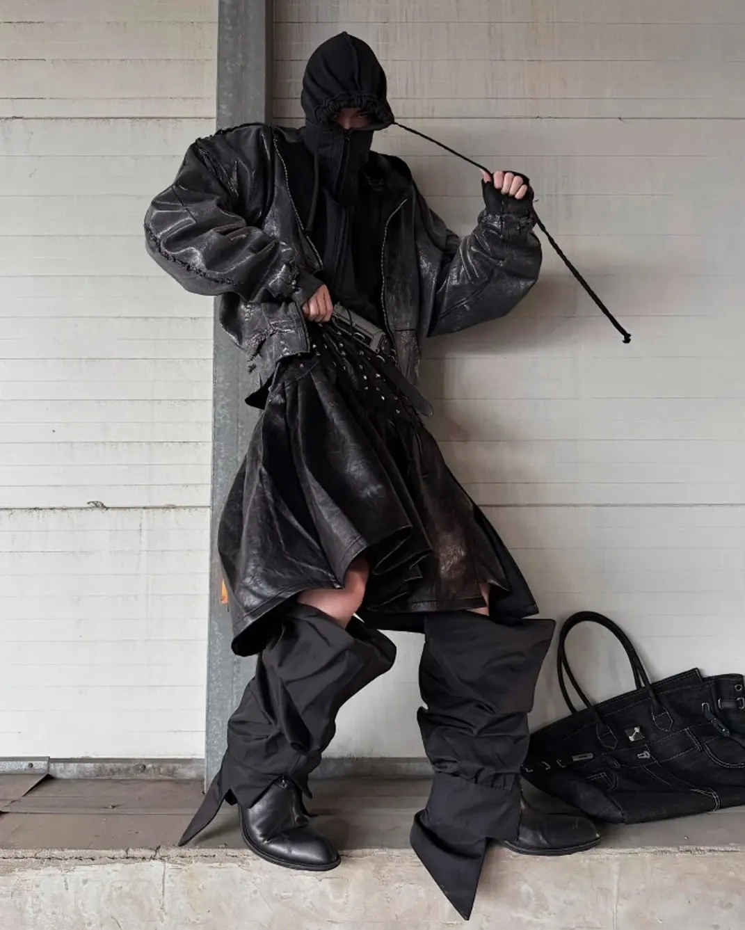 Steel in the spine. Shadows in the fold. Walk like you own the wasteland. Shop now at psylos1.com GOJOYJINNI | Rivet Pleat Leather Skirt #villainarc #techwear #darkfashion #runway (2/3)