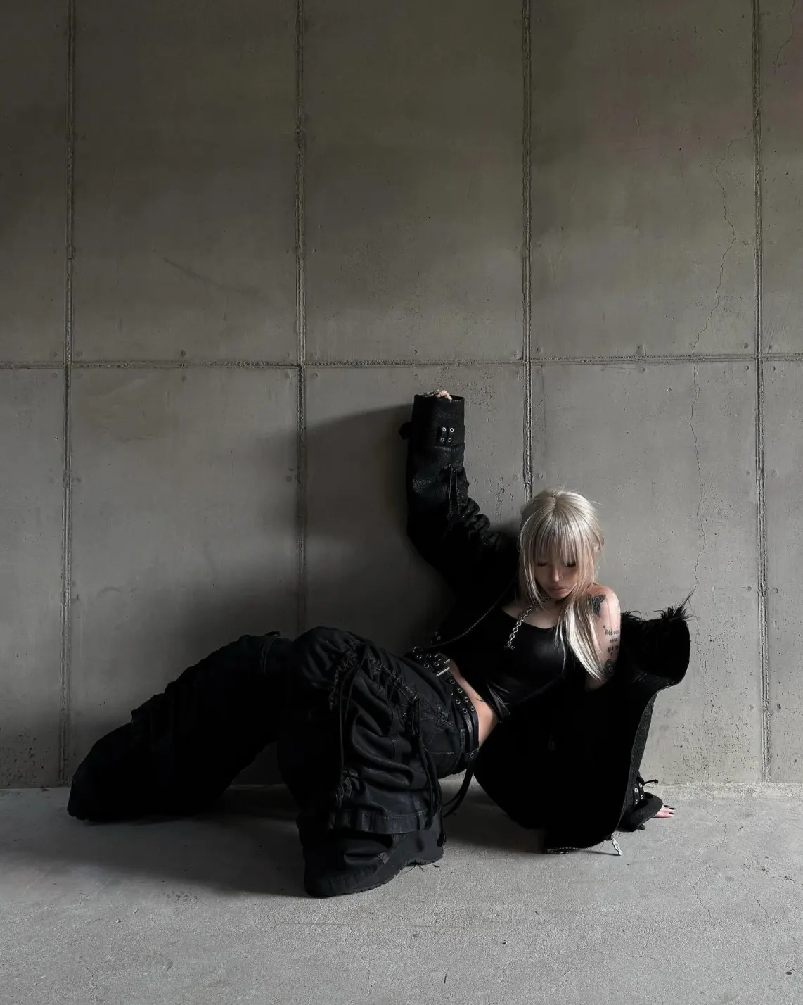 Heavy black straps. Soft fur lining. Become the main character of your own dystopia. ATA NOTHINGNESS Shop the drop via link in bio. #darkfashion #edgystyle #leatherjacket #streetgoth (2/5)
