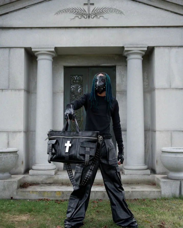 Crosses carved in cracked leather, like armor from a city that never sleeps. A tote built for the ones who move with noise. Carry the chaos at psylos1.com #REBELWAVE #psylos1 #streetavantgarde #industrialstyle #darkfashion (5/5)